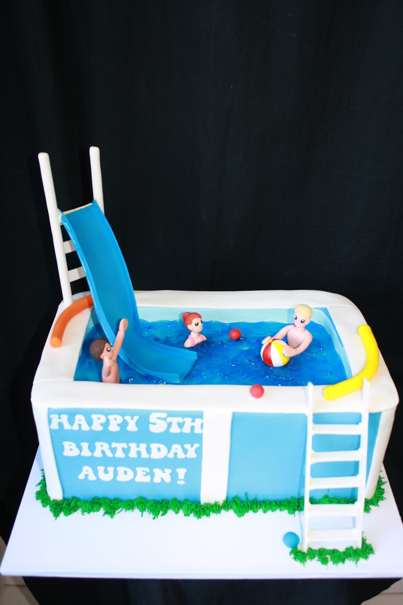 Swimming pool cake with a water slide